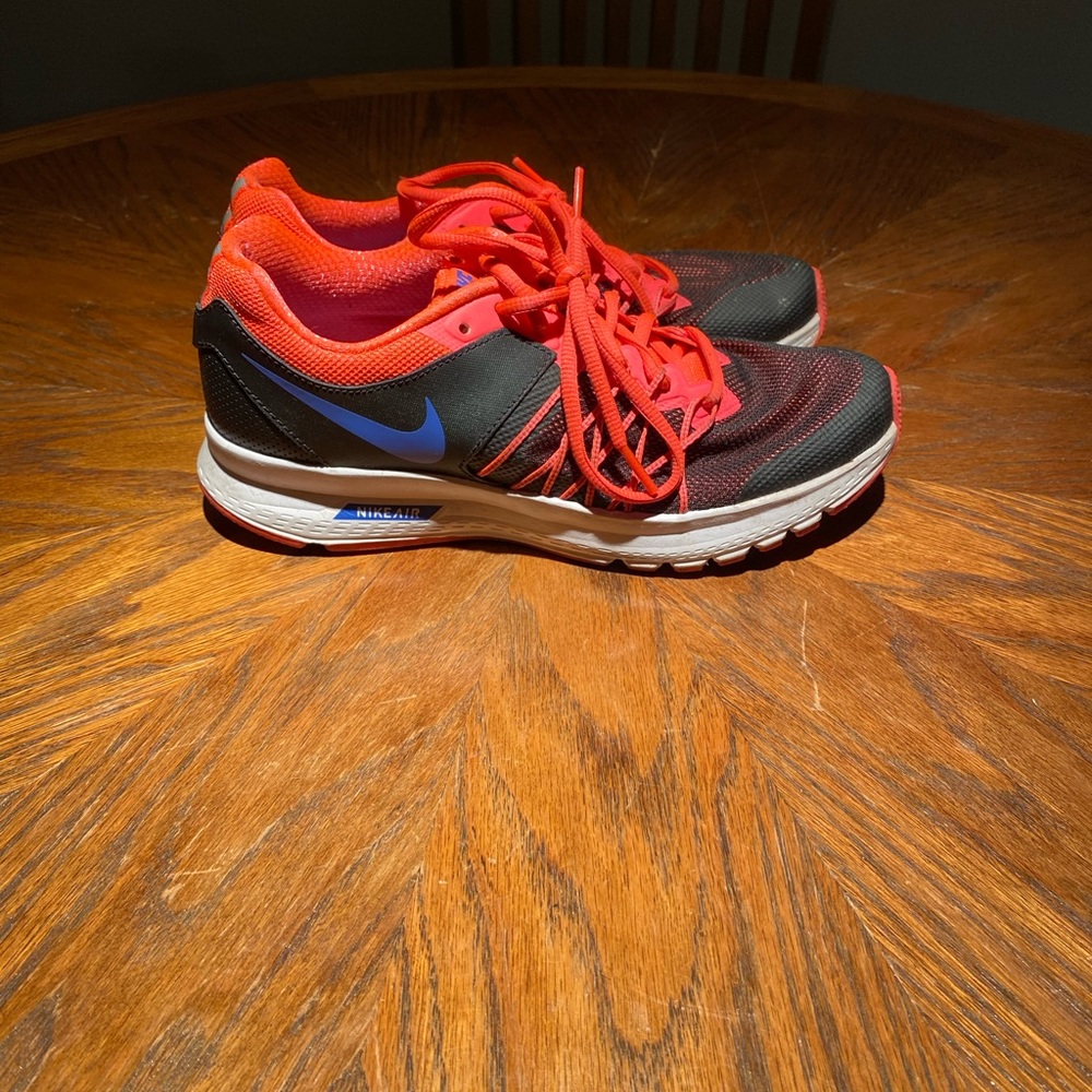 Black and pink Nike running shoes